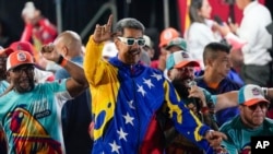 President Nicolas Maduro dances outside the Miraflores presidential palace after electoral authorities declared him the winner of the presidential election in Caracas, Venezuela, July 29, 2024.