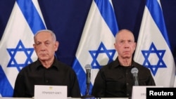 FILE - Israeli prime minister Benjamin Netanyahu and defense minister Yoav Gallant during a press conference at Kirya military base in Tel Aviv , Oct. 28, 2023. 