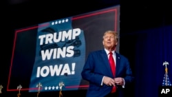 Republican presidential candidate and former President Donald Trump takes the stage at a caucus night party in Des Moines, Iowa, Jan. 15, 2024.