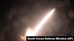 In this photo provided by South Korea Defense Ministry, n Army Tactical Missile System or ATACMS, missile is fired during a joint military drill between U.S. and South Korea at an undisclosed location in South Korea, Oct. 5, 2022. The Joint Chiefs of Staf