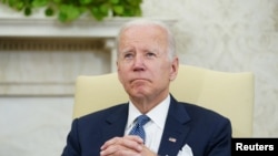 U.S. President Joe Biden listens during his meeting with Mexican President Andres Manuel Lopez Obrador in the Oval Office of the White House in Washington, July 12, 2022.