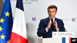 French President Emmanuel Macron speaks during a media conference after an EU summit in Brussels, March 25, 2022. 