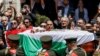 Palestinians bid farewell to Al Jazeera journalist Shireen Abu Akleh, who was killed during an Israeli raid, in Ramallah in the Israeli-occupied West Bank, May 12, 2022. 