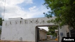 Police sit outside the facilities of La Prensa newspaper in Managua, Nicaragua Aug. 23, 2022.