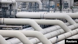 FILE - Pipes are pictured at a gas compressor station in Mallnow, Germany, Nov. 1, 2021.