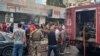 People and first responders gather at the scene of a reported device explosion in Saida in southern Lebanon on September 18, 2024.