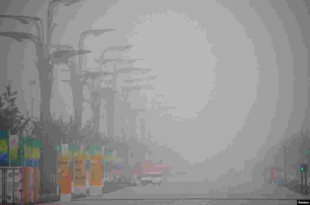 Haze blankets the National Stadium, also known as the Bird&#39;s Nest, as seen from inside the Olympic Green area during the Olympics, August 7, 2008. 