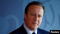 Britain's Foreign Secretary David Cameron delivers a speech at the National Cyber Security Centre