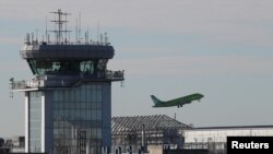 File - A plane takes off at the Domodedovo Airport outside Moscow, Nov. 2, 2017.