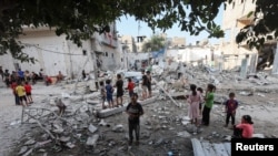 Aftermath of an Israeli strike on a house, in Maghazi refugee camp in the central Gaza Strip