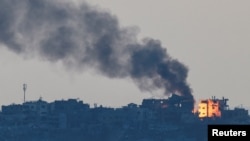 Smoke rises in northern Gaza, amid the ongoing conflict between Israel and Hamas, as seen from Israel, Oct. 7, 2024. 