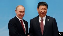 Tổng thống Nga Vladimir Putin và Chủ tịch Trung Quốc Tập Cận Bình.
