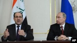 Tổng thống Nga Vladimir Putin (phải) và Thủ tướng Iraq Nouri al Maliki tại một cuộc họp báo trong khu dinh thự Novo-Ogaryovo, bên ngoài Moscow, 10/10/2012