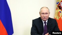 Russian President Putin delivers a video address to mark the 31st anniversary of the founding of Gazprom, outside Moscow