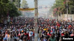 People march during a protest against the government and rising fuel prices, in Port-au-Prince, Haiti, Oct. 3, 2022.