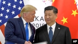 Tổng thống Mỹ Donald Trump và Chủ tịch Trung Quốc Tập Cận Bình trong cuộc gặp bên lề thượng đỉnh G20 ở Nhật, ngày 29/6/19.