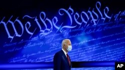 FILE - In this Thursday, Oct. 15, 2020 file photo, Democratic presidential candidate former Vice President Joe Biden arrives to participate in a town hall with moderator ABC News anchor George Stephanopoulos at the National Constitution Center in…