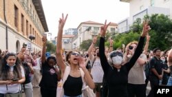 Pro-Palestinian students chant as they protest the Israel-Hamas war on the campus of the University of Texas in Austin, Texas, on April 24, 2024.