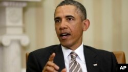 President Barack Obama answers a question from a reporter during his meeting with Japan's Prime Minister Shinzo Abe at the White House, Feb. 22, 2013. 