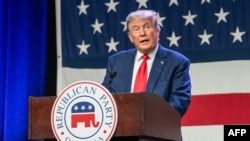 (FILES) Former US president and 2024 Republican Presidential hopeful Donald Trump speaks at the Republican Party of Iowa's 2023 Lincoln Dinner at the Iowa Events Center in Des Moines, Iowa, on July 28, 2023.