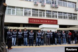 FILE - Police officers stand guard in front of the Supreme Electoral Board (YSK) in Ankara, April 2, 2014. The AKP is petitioning Turkey's Supreme Election Board, or YSK, to repeat last month's mayoral election in Istanbul.