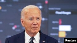 FILE PHOTO: U.S. President Joe Biden receives a briefing from federal officials on extreme weather at the D.C. Emergency Operations Center in Washington