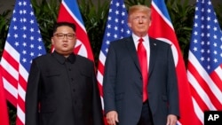 Tổng thống Mỹ Donald Trump và lãnh đạo Bắc Triều Tiên Kim Jong Un