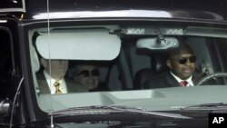 Secretary of State Hillary Clinton, center, is transported on the New York Presbyterian Hospital complex Wednesday, Jan. 2, 2013. 