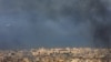 TOPSHOT - A Middle East Airlines commercial aircraft taking off from Beirut's international airport, flies amid smoke billowing above the Lebanese capital's southern suburbs, in the aftermath of overnight Israeli airstrikes, on September 28,2024.