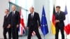 German Chancellor Olaf Scholz, U.S. President Joe Biden, Britain's Prime Minister Keir Starmer and French President Emmanuel Macron prepare to pose for a family photo session, at the Chancellery in Berlin, Germany, Oct. 18, 2024. 